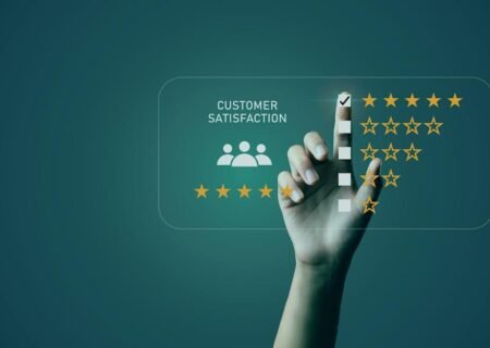 Businessman's hand pointing to customer satisfaction survey Users rate the service experience on the online application. Customers can assess the quality of service leading to a business reputation rating.