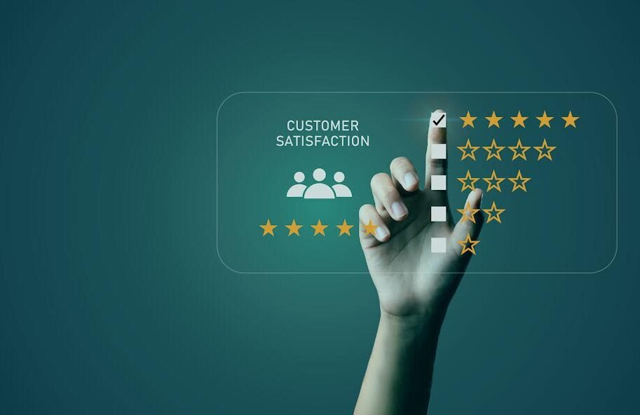 Businessman's hand pointing to customer satisfaction survey Users rate the service experience on the online application. Customers can assess the quality of service leading to a business reputation rating.